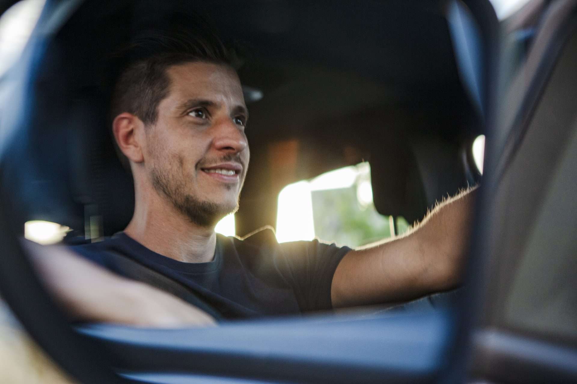 reflection of man driving car